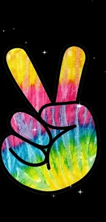 Colorful peace sign with rainbow colors on a black starry background.