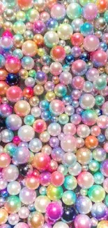 Vibrant explosion of colorful pearls on a mobile wallpaper.