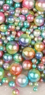 Colorful pearls scattered on a surface, creating an elegant wallpaper.