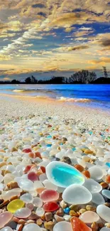 Vibrant pebble beach at sunset with colorful sky.