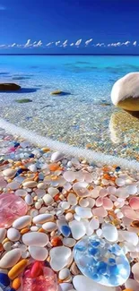 Vibrant beach with colorful pebbles and a bright blue ocean.