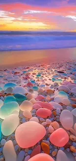 Vibrant beach pebbles under a colorful sunset sky at the ocean.