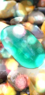 Turquoise pebble surrounded by colorful stones and bokeh effect.