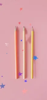 Colorful pencils with star pattern on pink background.