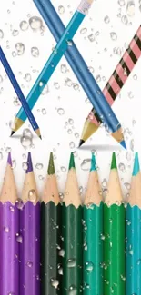 Mobile wallpaper with colorful pencils and water droplets.