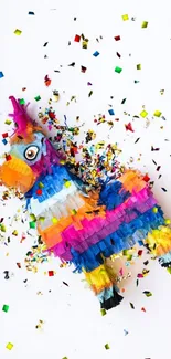 Colorful piñata with confetti on white background.