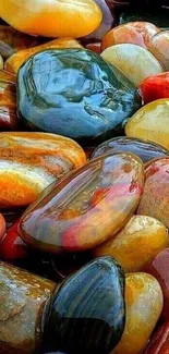 A vibrant collection of colorful polished stones in various shades, perfect for mobile wallpaper.