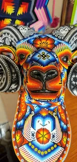 Colorful beaded ram head design with vibrant patterns.