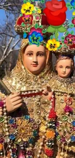 Statue with colorful flowers and gold details on a blue sky background.