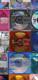 Colorful retro mini-disks arranged in a vibrant pattern.