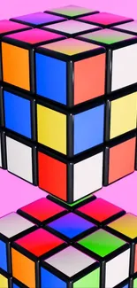 Colorful 3D Rubik's Cube on pink background.