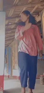 Woman in colorful rustic corridor with painted walls.