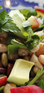 Colorful salad with beans in blue bowl on table.