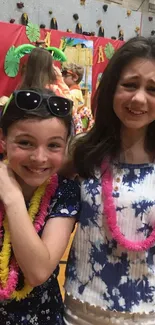 Kids enjoying a colorful school event inside a gym.