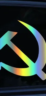 Colorful hammer and sickle symbol on dark background.