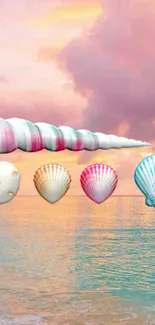 Colorful seashells set against a calm ocean sunset backdrop.