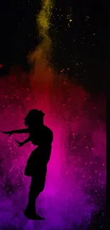 Silhouette against colorful splash background.