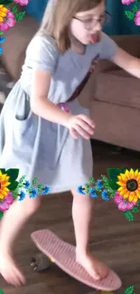 Young girl skateboards indoors with bright floral border.