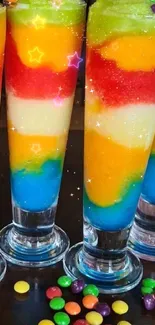 Colorful layers of Skittles cocktail with vibrant hues.