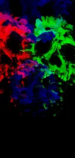 Vibrant abstract skull in red, green, blue on black background wallpaper.