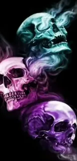 Vibrant skull wallpaper with pink, purple, cyan smoke on black background.