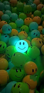 A cluster of glowing green and blue smiley face balloons.