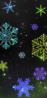 Vibrant snowflakes on a starry night sky wallpaper.