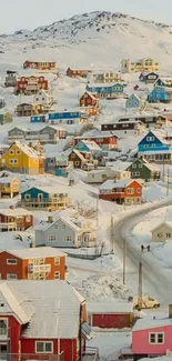 Colorful houses in a snowy village landscape.