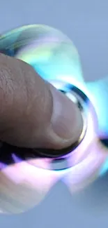 Close-up of a colorful spinning fidget toy in motion.