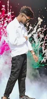 Man posing with colorful splash background on a mobile wallpaper.