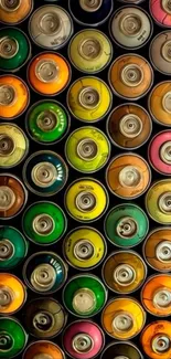 Colorful arrangement of spray paint cans.