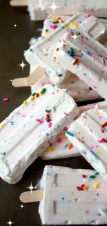 White ice cream bars with colorful sprinkles on top.