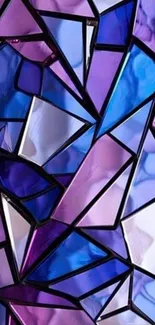 Colorful stained glass with geometric patterns in purple and blue shades.