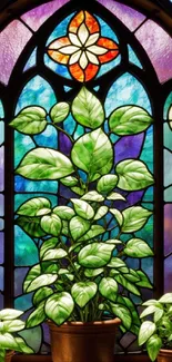 Colorful stained glass with green leaves design on a phone wallpaper.