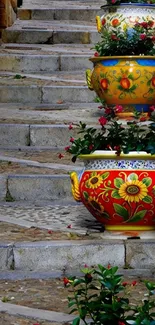 Colorful pots on stone staircase with floral designs.