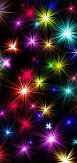 Vibrant starburst wallpaper with colorful light explosions on a dark background.