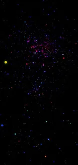 Vibrant starry night sky wallpaper with colorful galaxy dots on a black background.