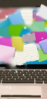Vibrant sticky notes on a laptop screen wallpaper.
