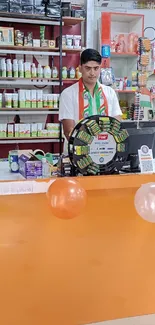 Colorful store counter with festive balloons.