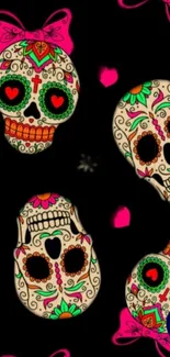 Colorful sugar skulls on a black background wallpaper.