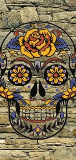 Colorful skull with floral designs on stone background.