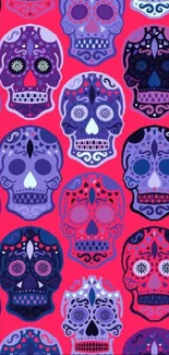 Colorful sugar skulls pattern with a red background.