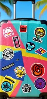 Colorful suitcase with stickers on a sunny beach.