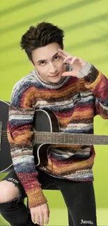 Guitarist with colorful sweater on a lime green background in creative pose.