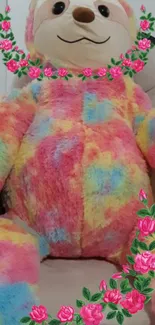 Vibrant plush teddy bear with floral accents.