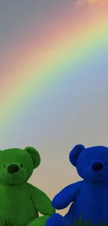 Teddy bears under a vibrant rainbow in the sky.