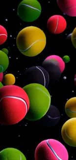 Colorful tennis balls floating on black background