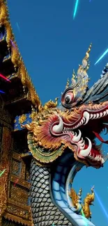 Intricate Thai dragon against blue sky, vibrant colors.