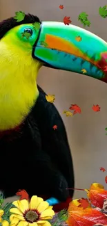 Toucan with vibrant beak among autumn leaves.