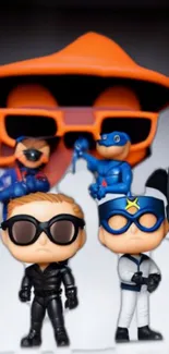 Superhero toy figures in a colorful display with bright orange accents.